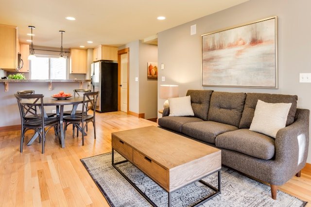 A living area that extends into a kitchen area