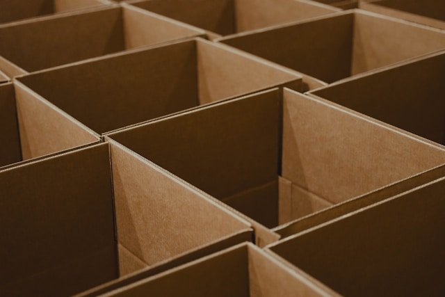 Lines of open cardboard boxes